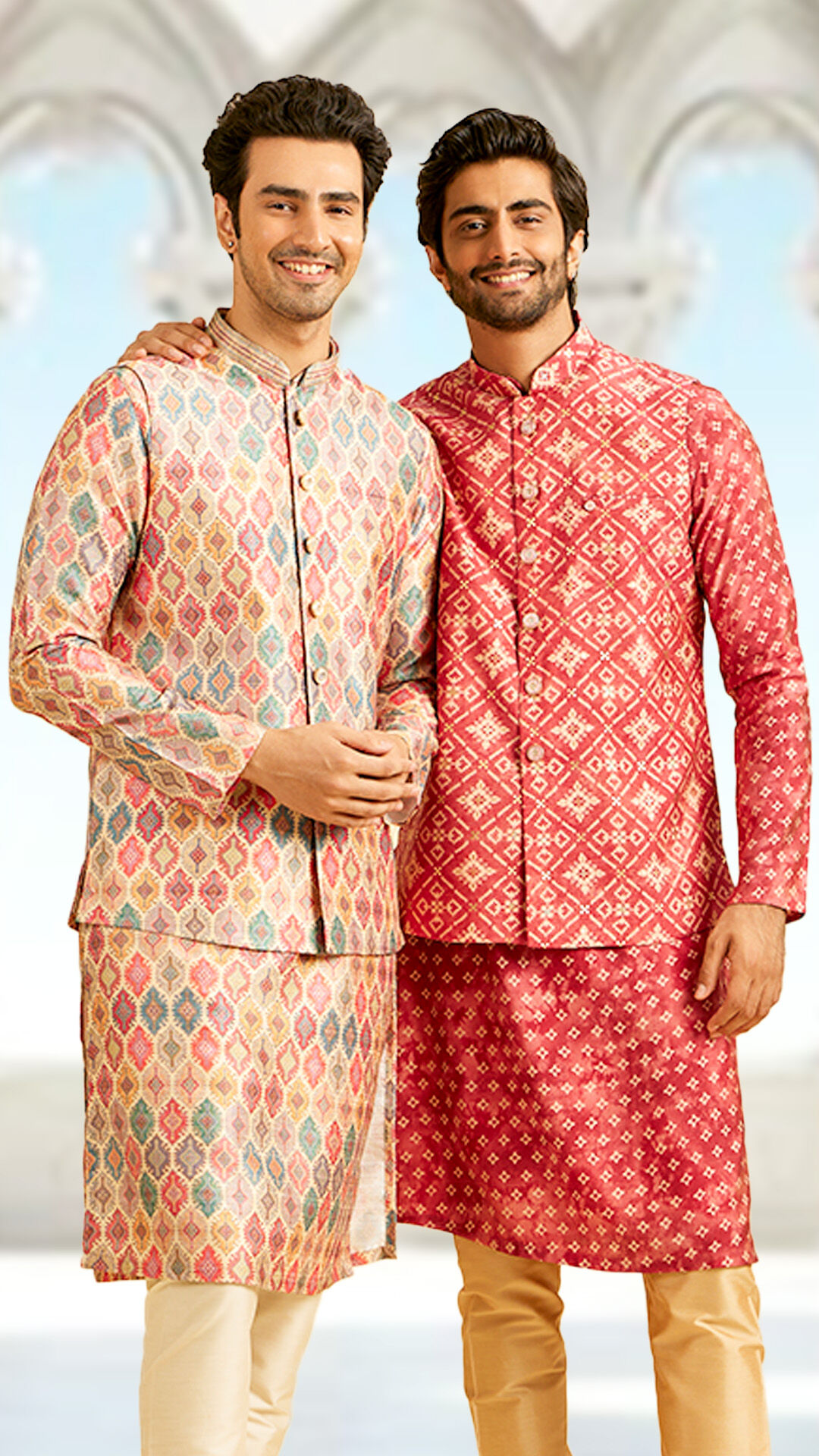 Fashionable men sporting a multi-colored designer kurta jacket set, ideal for a stylish family twinning look at weddings